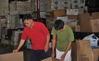 2012-07-22 Volunteers in Warehouse Packing